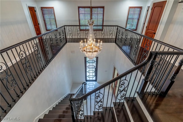 1160 8th St S, Naples, FL 34102 - staircase with an inviting chandelier and a towering ceiling