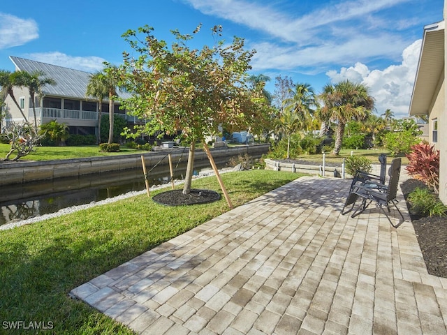 view of patio / terrace featuring a water view