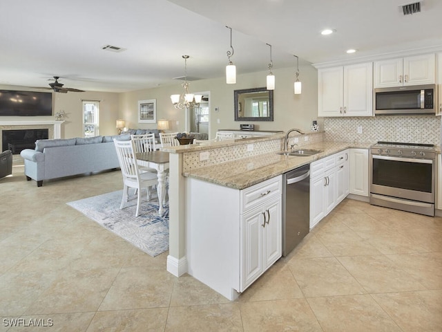 kitchen featuring white cabinetry, sink, and appliances with stainless steel finishes