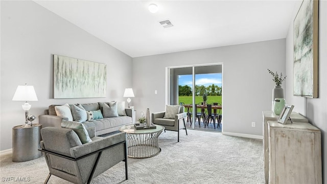 living room with light carpet and lofted ceiling