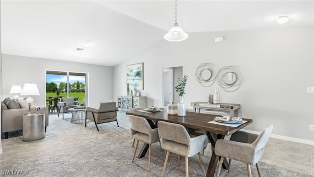 dining room with vaulted ceiling