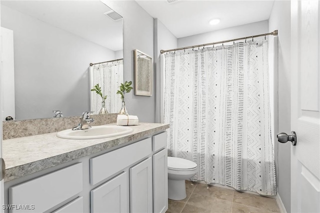 bathroom featuring tile patterned floors, vanity, toilet, and a shower with curtain