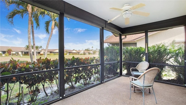 sunroom / solarium with ceiling fan