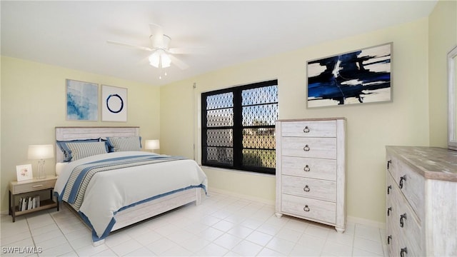 bedroom with light tile patterned flooring and ceiling fan