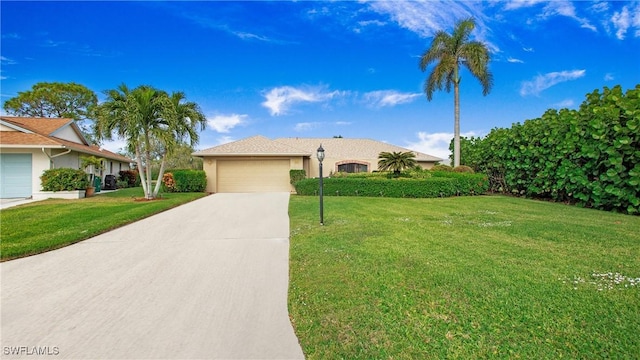 ranch-style house featuring a garage, concrete driveway, a front lawn, and stucco siding