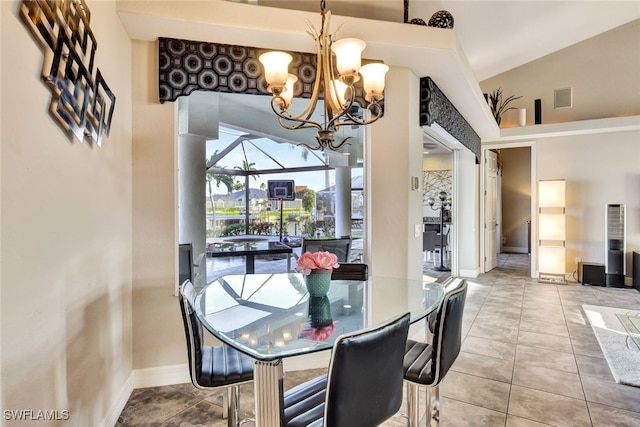 dining room with light tile patterned floors and a chandelier