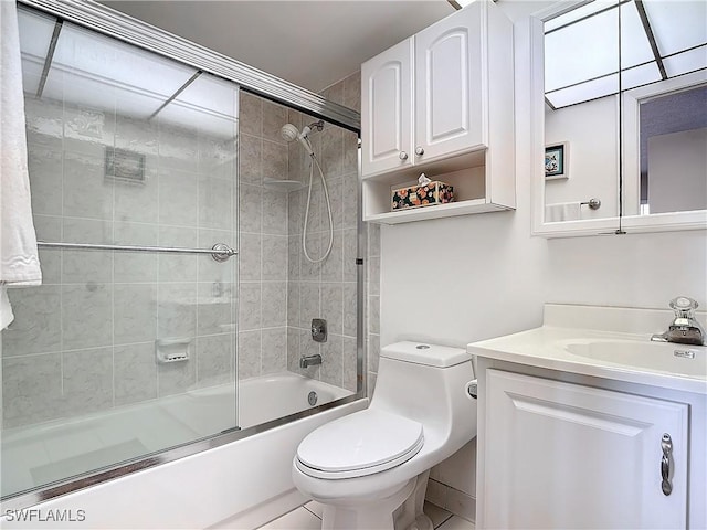 full bathroom with enclosed tub / shower combo, toilet, and vanity