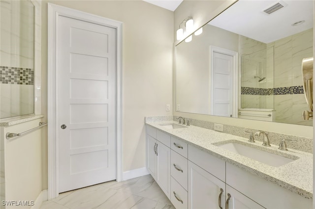 bathroom featuring vanity and an enclosed shower