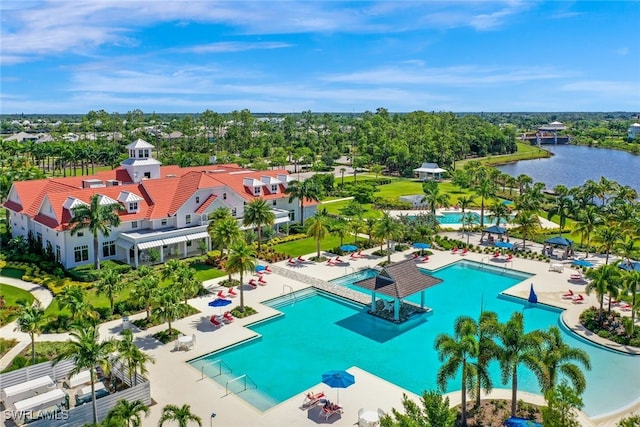 birds eye view of property with a water view