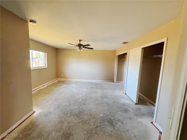 unfurnished bedroom with concrete flooring, a closet, and ceiling fan