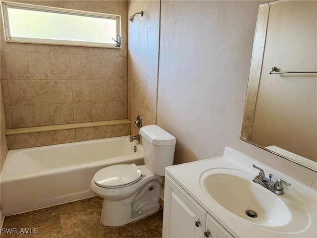 full bathroom featuring vanity, toilet, and tiled shower / bath