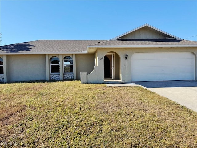 ranch-style house with a front yard and a garage