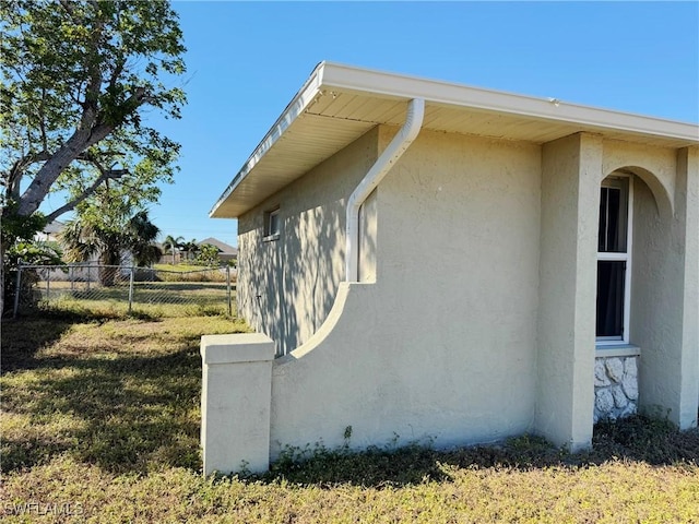 view of property exterior featuring a lawn