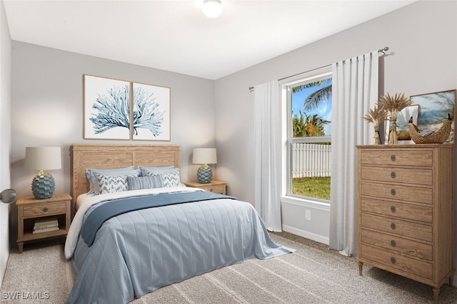 bedroom featuring light carpet