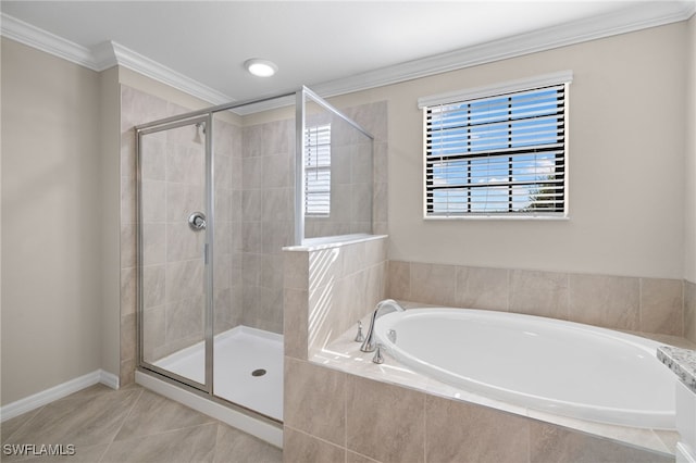 bathroom with tile patterned flooring, ornamental molding, and shower with separate bathtub