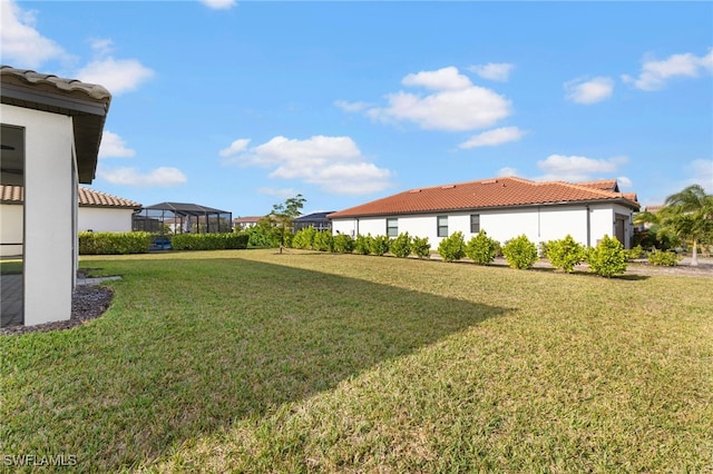 view of yard featuring a lanai