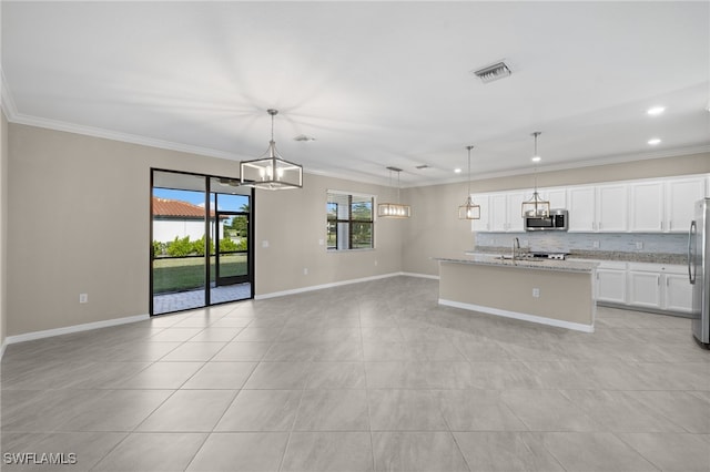 kitchen with appliances with stainless steel finishes, a kitchen island with sink, crown molding, pendant lighting, and white cabinetry