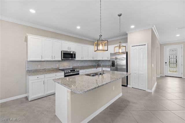 kitchen featuring white cabinets, sink, an island with sink, and stainless steel appliances