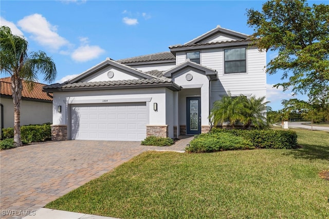 view of front of property with a garage and a front yard