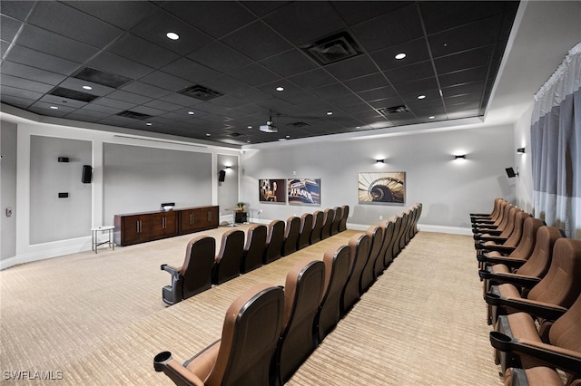 carpeted cinema featuring a paneled ceiling