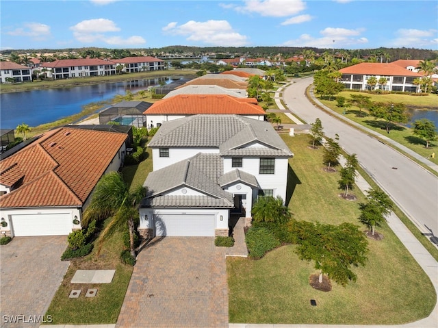 birds eye view of property with a water view