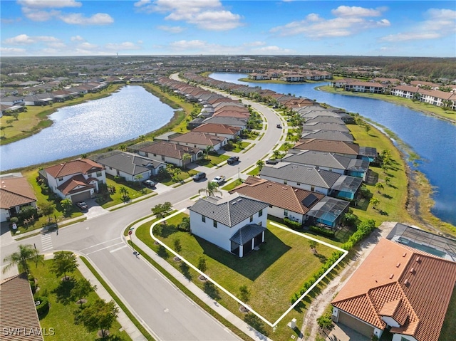 drone / aerial view featuring a water view