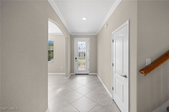 entrance foyer featuring light tile patterned flooring and crown molding