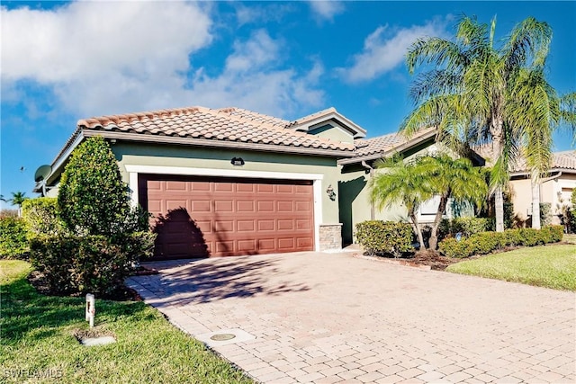 mediterranean / spanish-style home featuring a garage