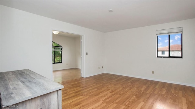 spare room featuring light hardwood / wood-style flooring