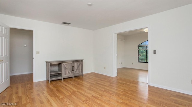 spare room featuring light hardwood / wood-style flooring