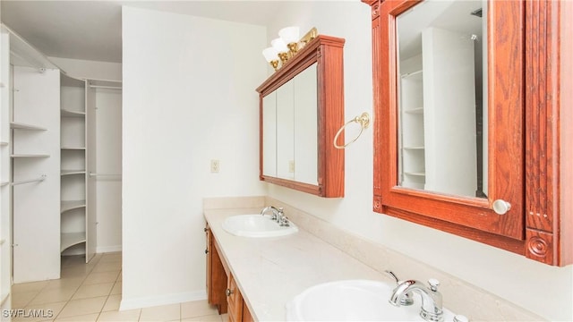 bathroom with tile patterned floors and vanity