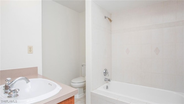 full bathroom with sink, tile patterned flooring, tiled shower / bath combo, and toilet