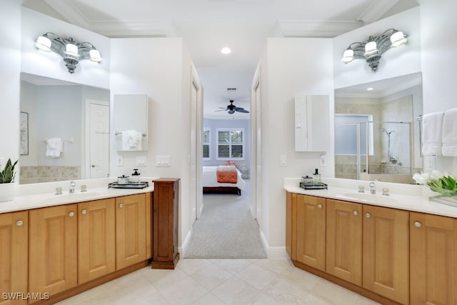 bathroom with vanity, ceiling fan, and a shower with shower door