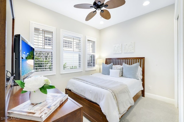 bedroom with light carpet and ceiling fan