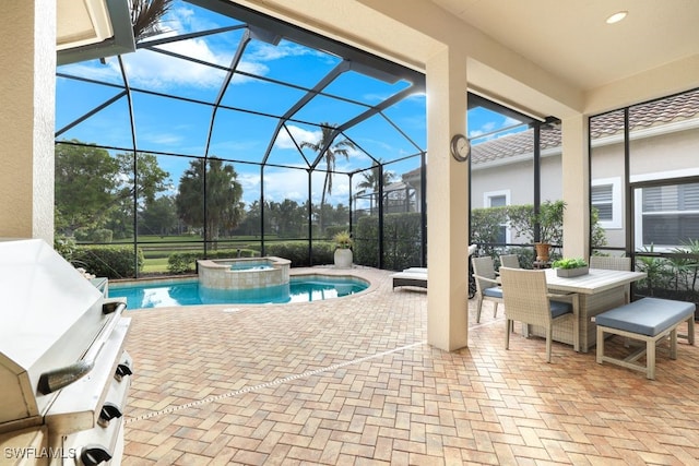 view of swimming pool featuring an in ground hot tub, a patio, and a lanai