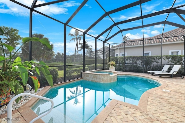 view of swimming pool featuring an in ground hot tub, a patio, and glass enclosure