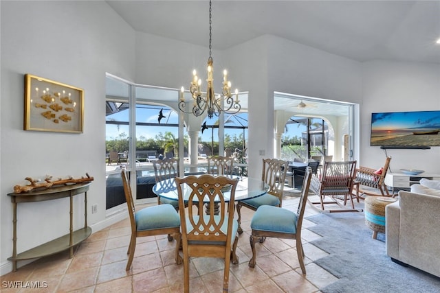 dining space featuring a notable chandelier and light tile patterned flooring