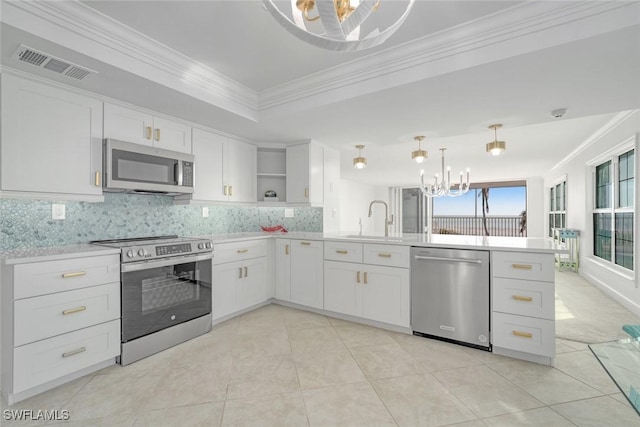 kitchen featuring white cabinetry, stainless steel appliances, tasteful backsplash, kitchen peninsula, and crown molding