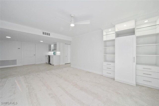 unfurnished living room with ceiling fan, light colored carpet, and ornamental molding