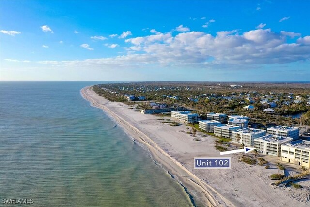 aerial view with a view of the beach and a water view