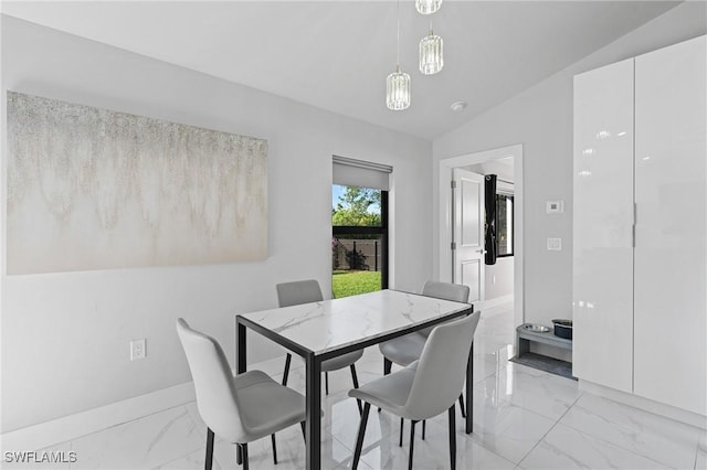 dining space with vaulted ceiling