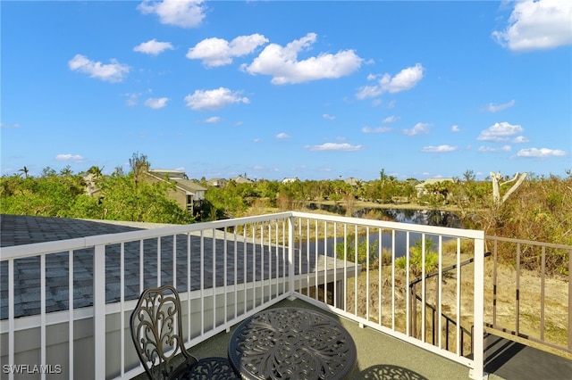 balcony featuring a water view