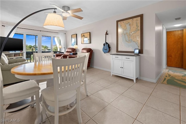 dining room with ceiling fan and light tile patterned floors