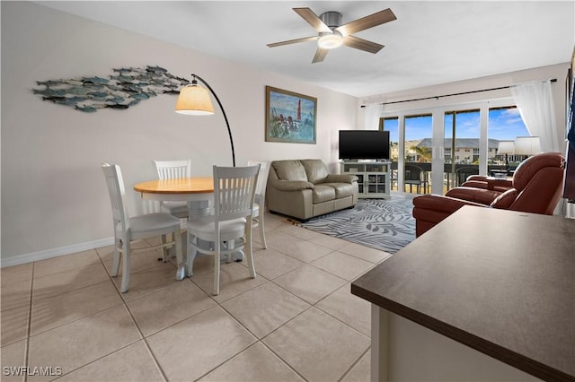 living room featuring tile patterned floors and ceiling fan