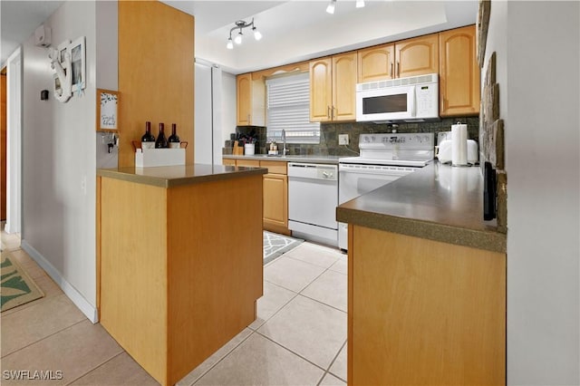 kitchen with light brown cabinets, white appliances, decorative backsplash, light tile patterned floors, and kitchen peninsula