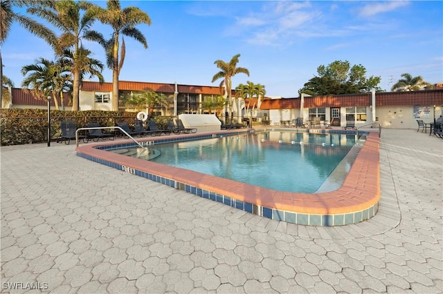 view of swimming pool with a patio area