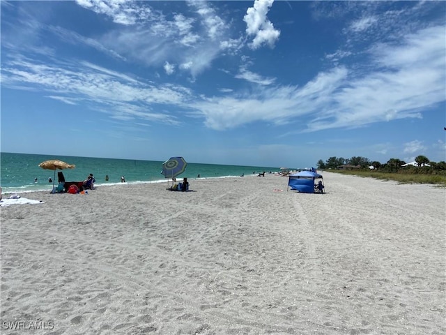 property view of water featuring a beach view