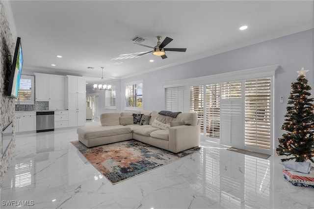 living room with ceiling fan with notable chandelier and ornamental molding