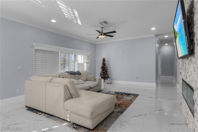 living room featuring ceiling fan, a fireplace, and crown molding