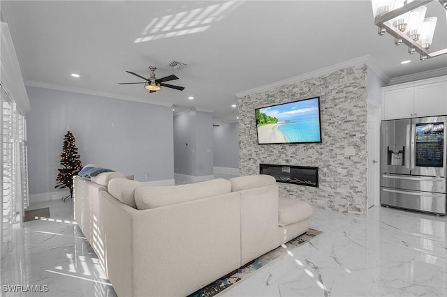 living room with crown molding, a fireplace, and ceiling fan